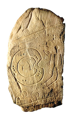 Signos y figura grabados en piedra