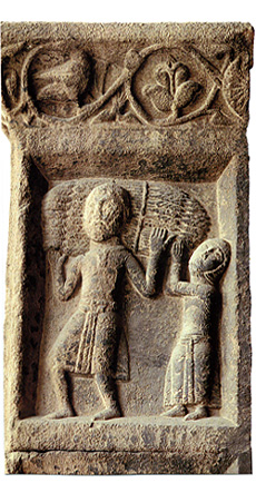 Un campesino y su mujer acarreando trigo (relieve románico del monasterio catalán de Ripoll)